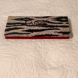 Zebra print clutch wristlet by Carlos Santana